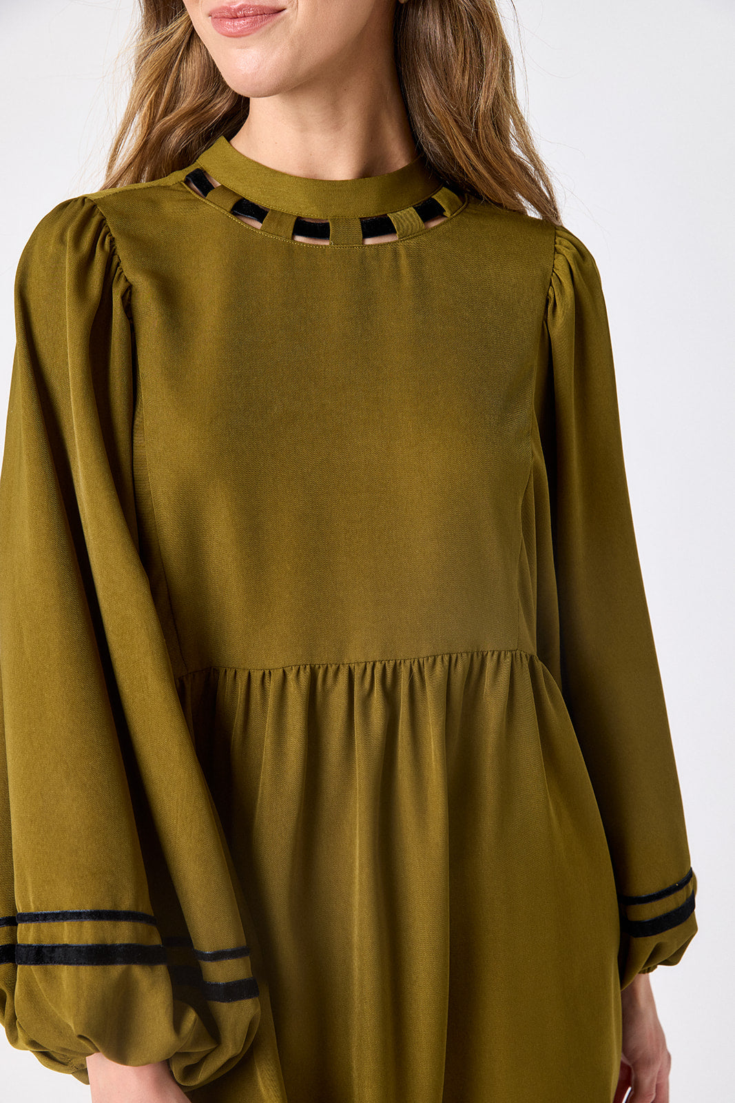 Dark Lichen above-the-knee dress with balloon sleeves on model – CROSBY by Mollie Burch