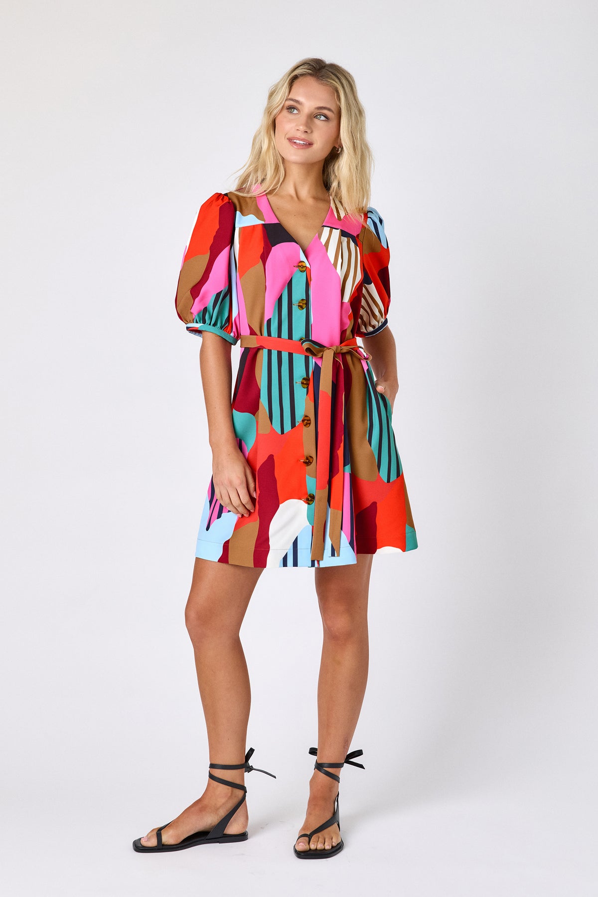 Field Study v-neck dress with puff sleeves and a swingy silhouette on model — CROSBY by Mollie Burch