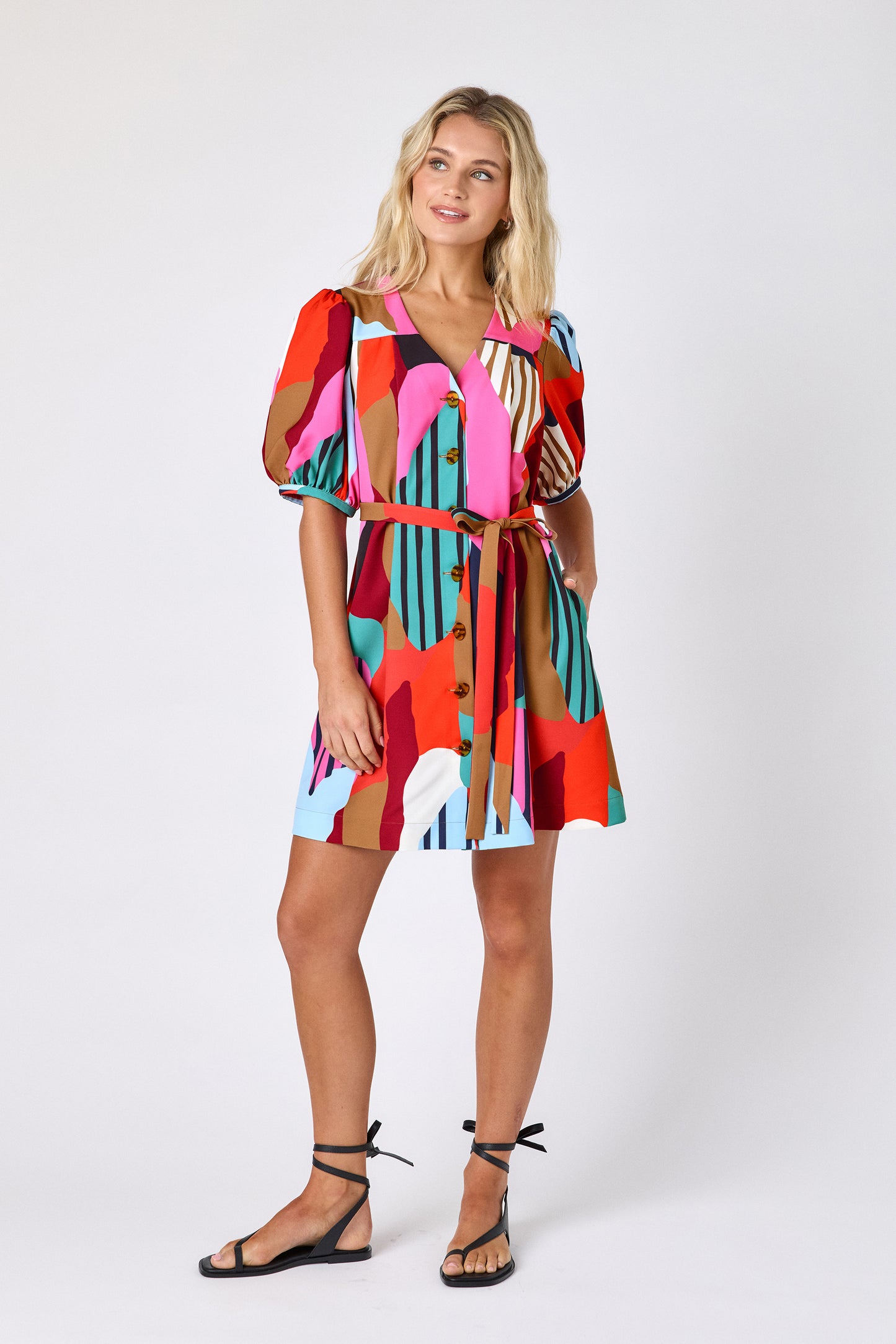 Field Study v-neck dress with puff sleeves and a swingy silhouette on model — CROSBY by Mollie Burch