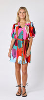 Field Study v-neck dress with puff sleeves and a swingy silhouette on model — CROSBY by Mollie Burch