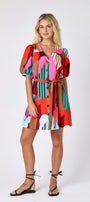 Field Study v-neck dress with puff sleeves and a swingy silhouette on model — CROSBY by Mollie Burch