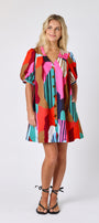 Field Study v-neck dress with puff sleeves and a swingy silhouette on model — CROSBY by Mollie Burch