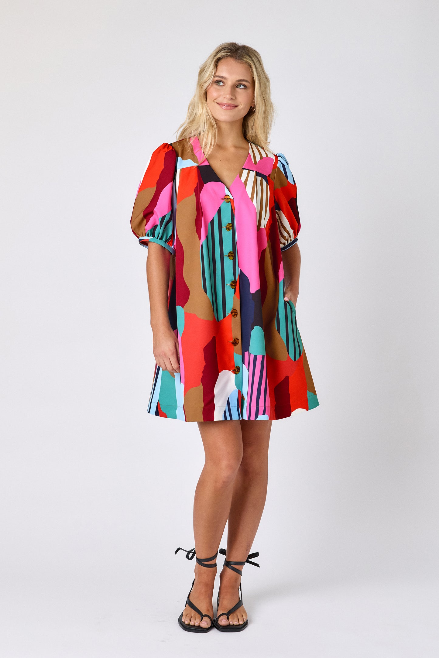 Field Study v-neck dress with puff sleeves and a swingy silhouette on model — CROSBY by Mollie Burch
