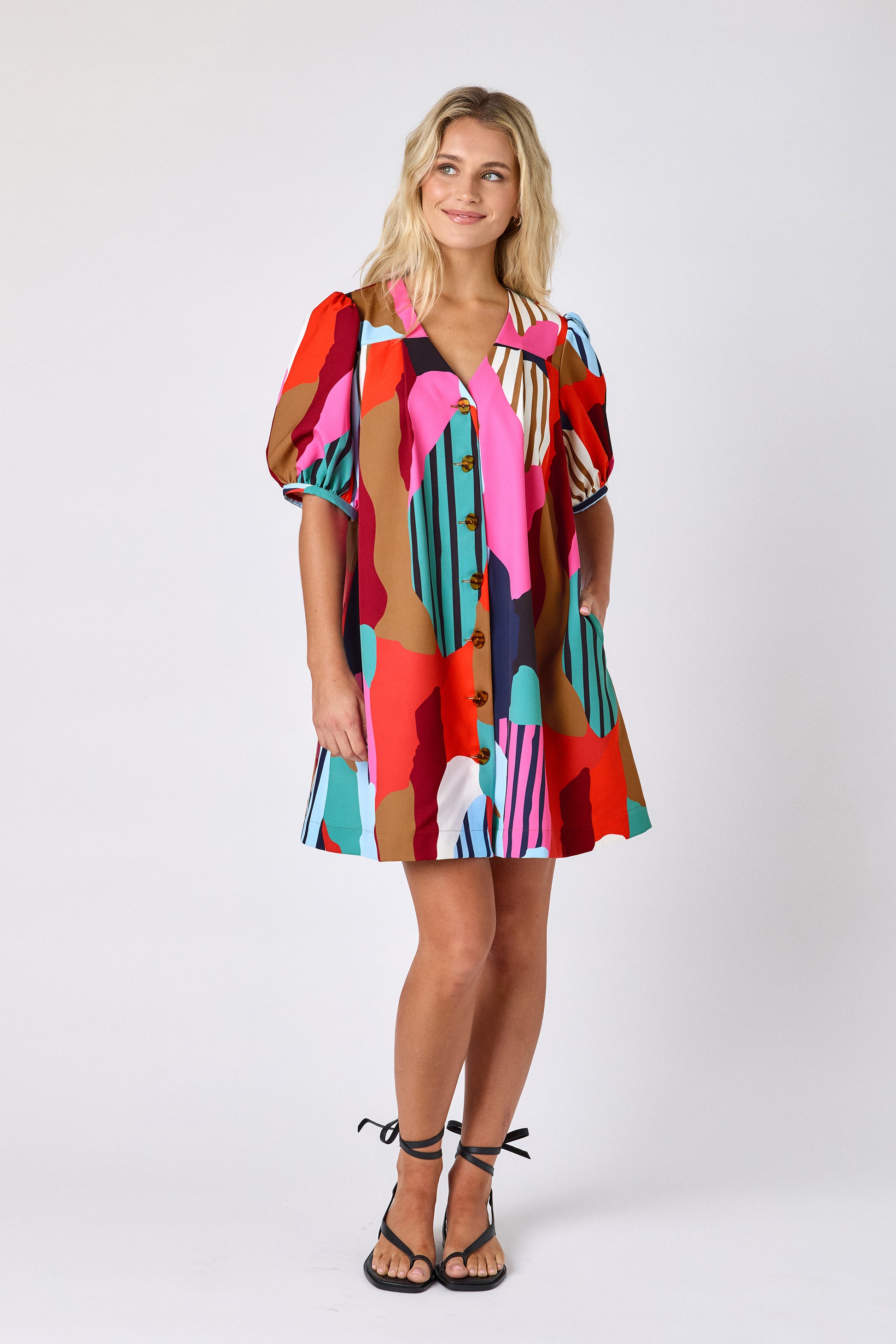 Field Study v-neck dress with puff sleeves and a swingy silhouette on model — CROSBY by Mollie Burch