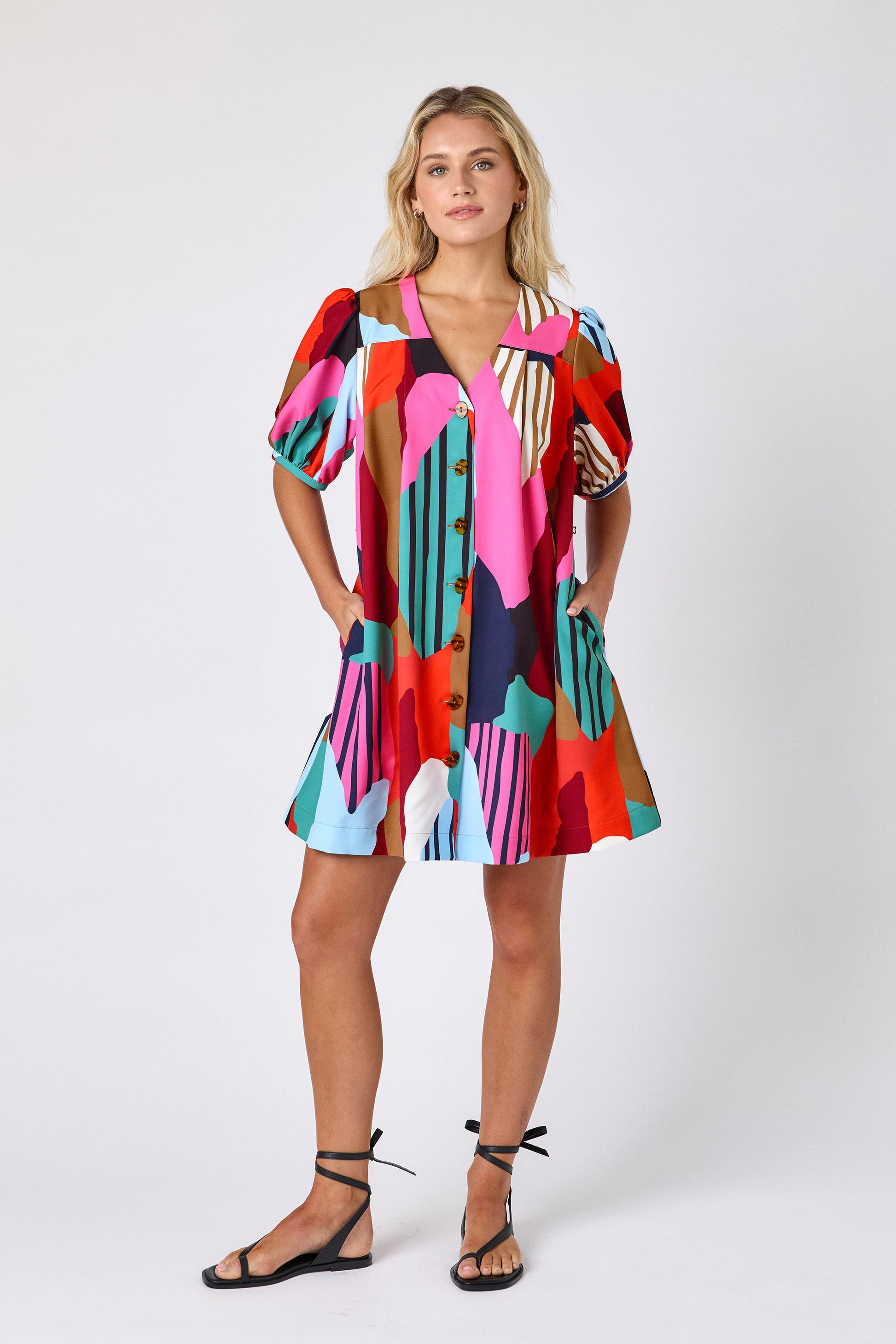 Field Study v-neck dress with puff sleeves and a swingy silhouette on model — CROSBY by Mollie Burch