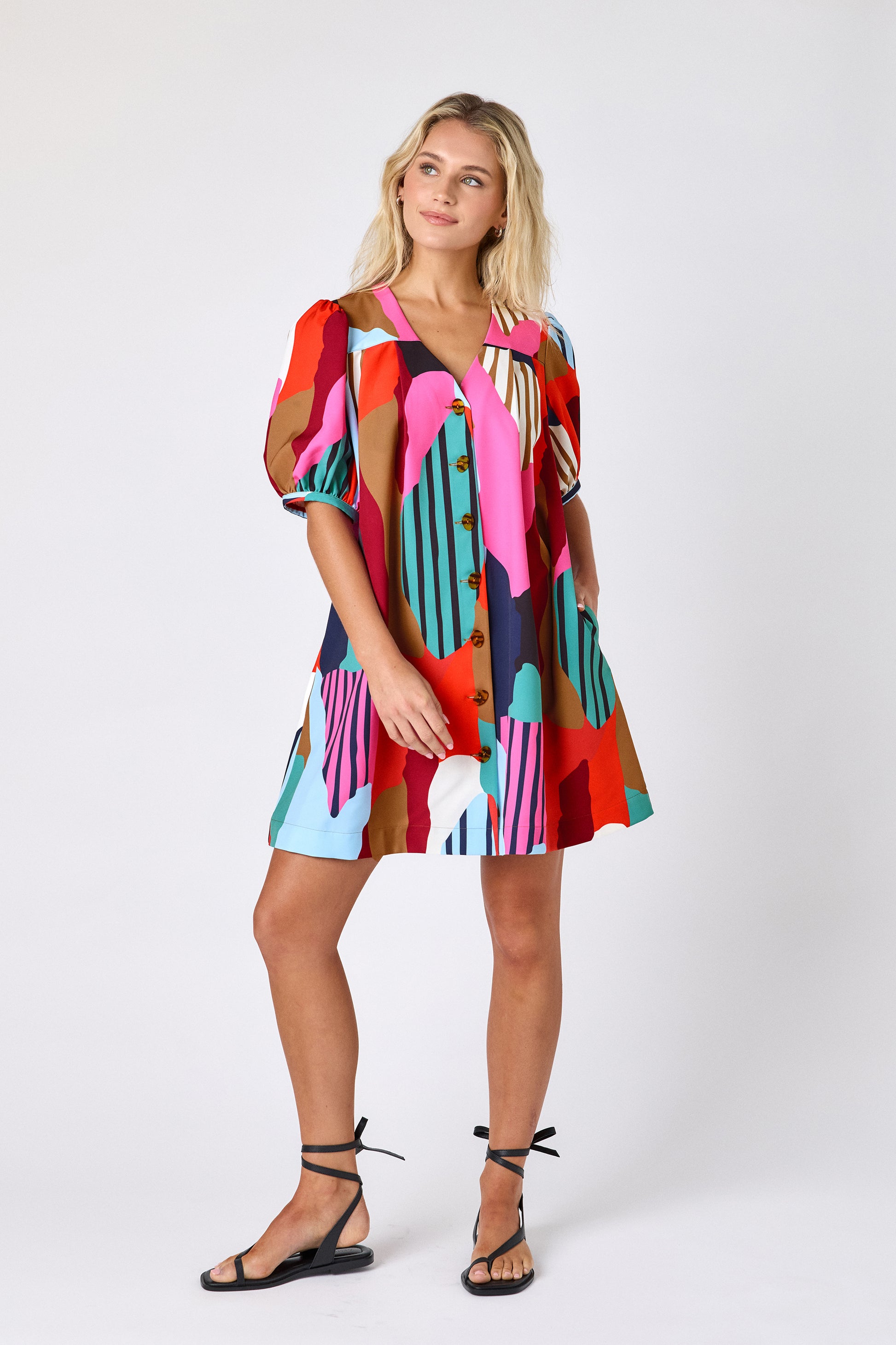 Field Study v-neck dress with puff sleeves and a swingy silhouette on model — CROSBY by Mollie Burch