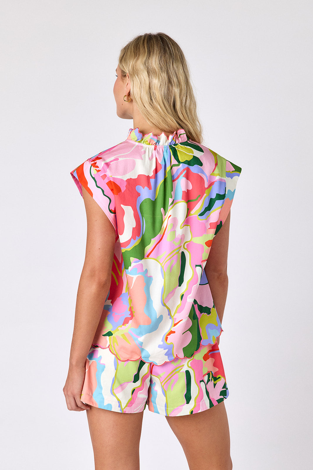 Flutter tailored shorts with belt on model — CROSBY by Mollie Burch