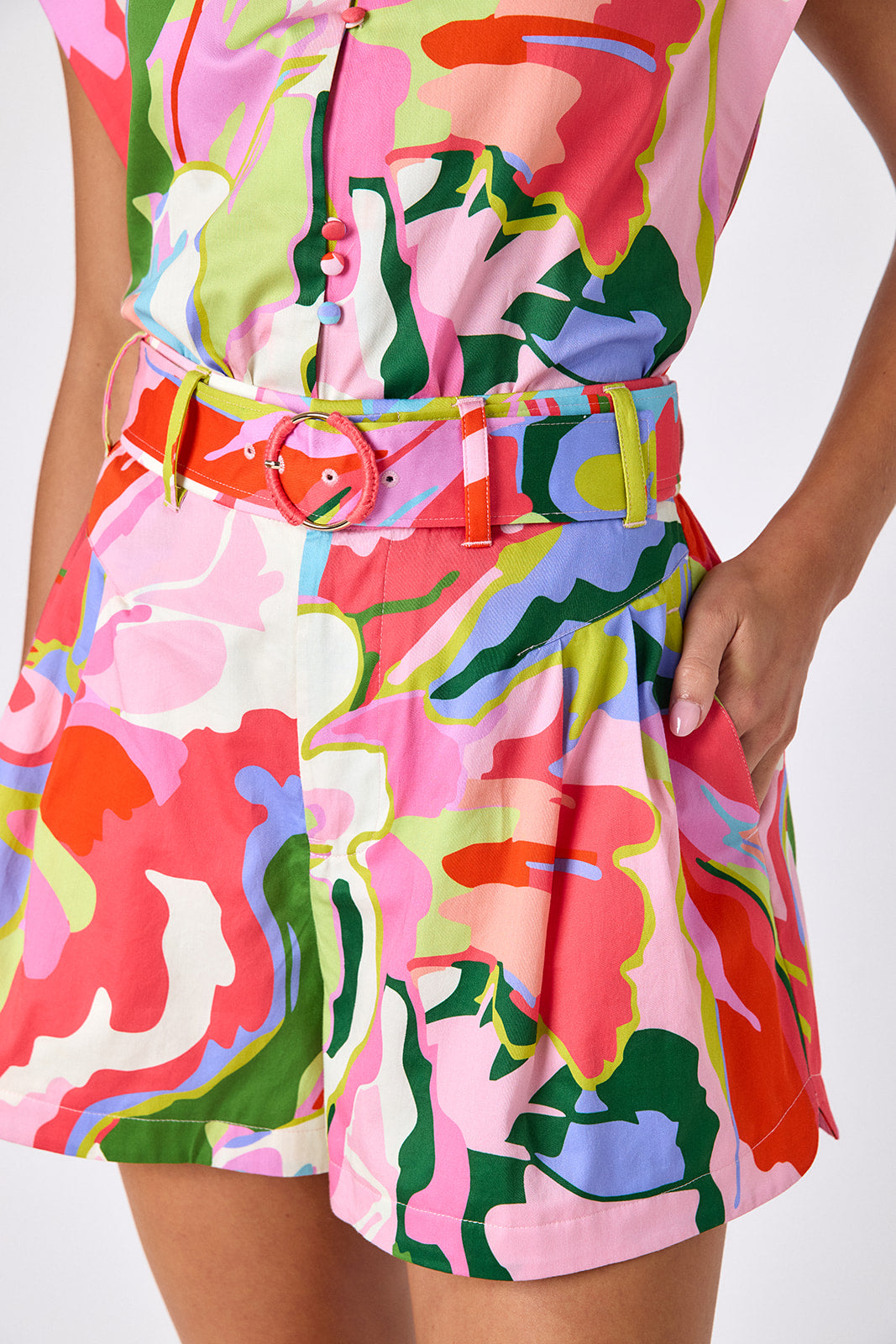 Flutter tailored shorts with belt on model — CROSBY by Mollie Burch