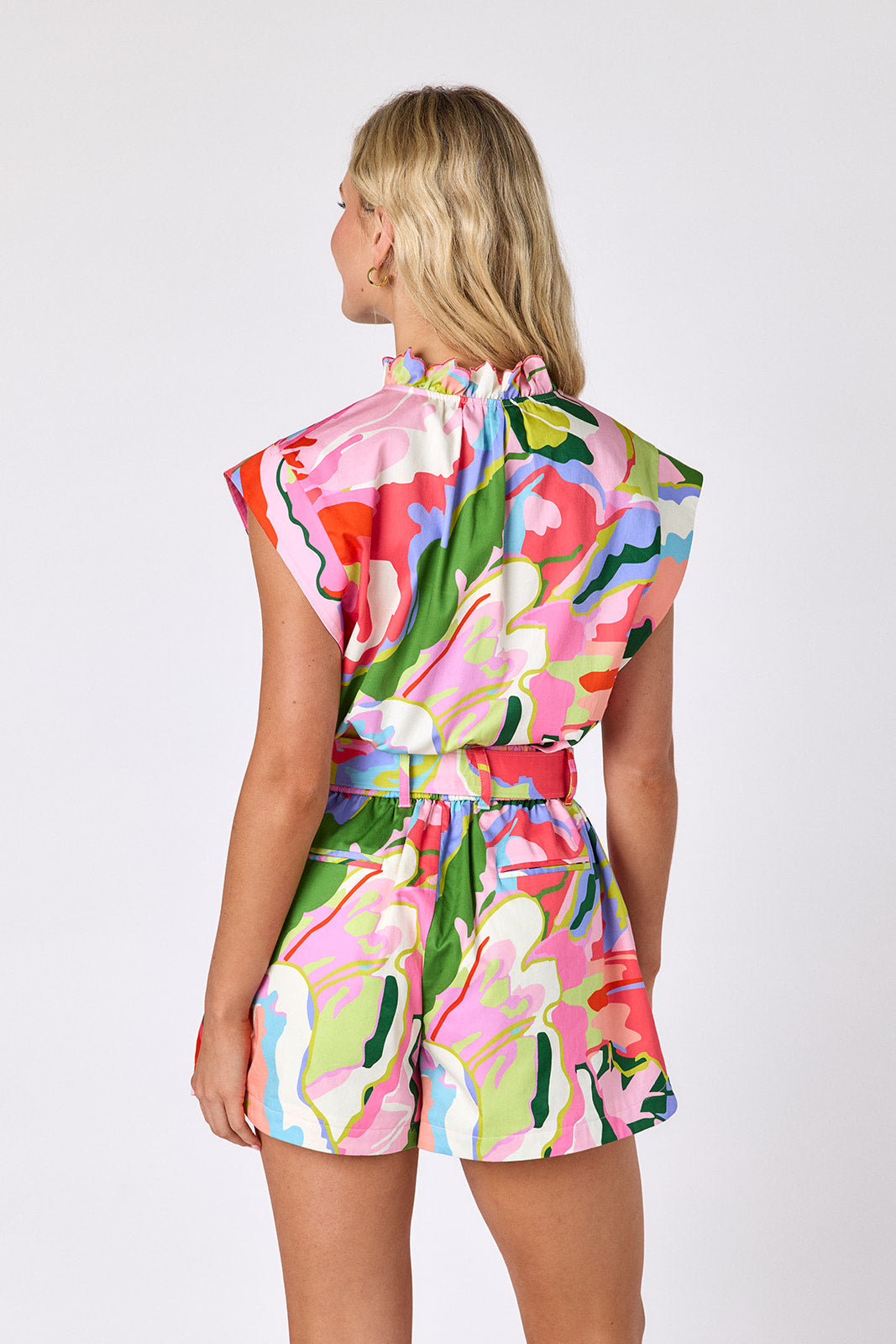 Flutter tailored shorts with belt on model — CROSBY by Mollie Burch