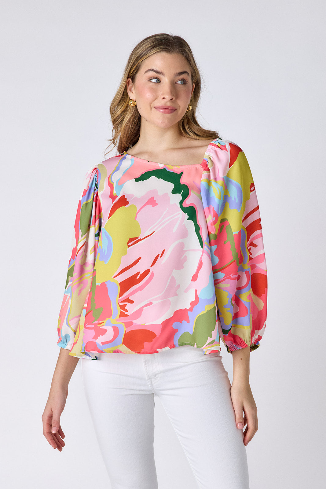 Flutter 3/4 sleeve top with asymmetrical neckline on model — CROSBY by Mollie Burch