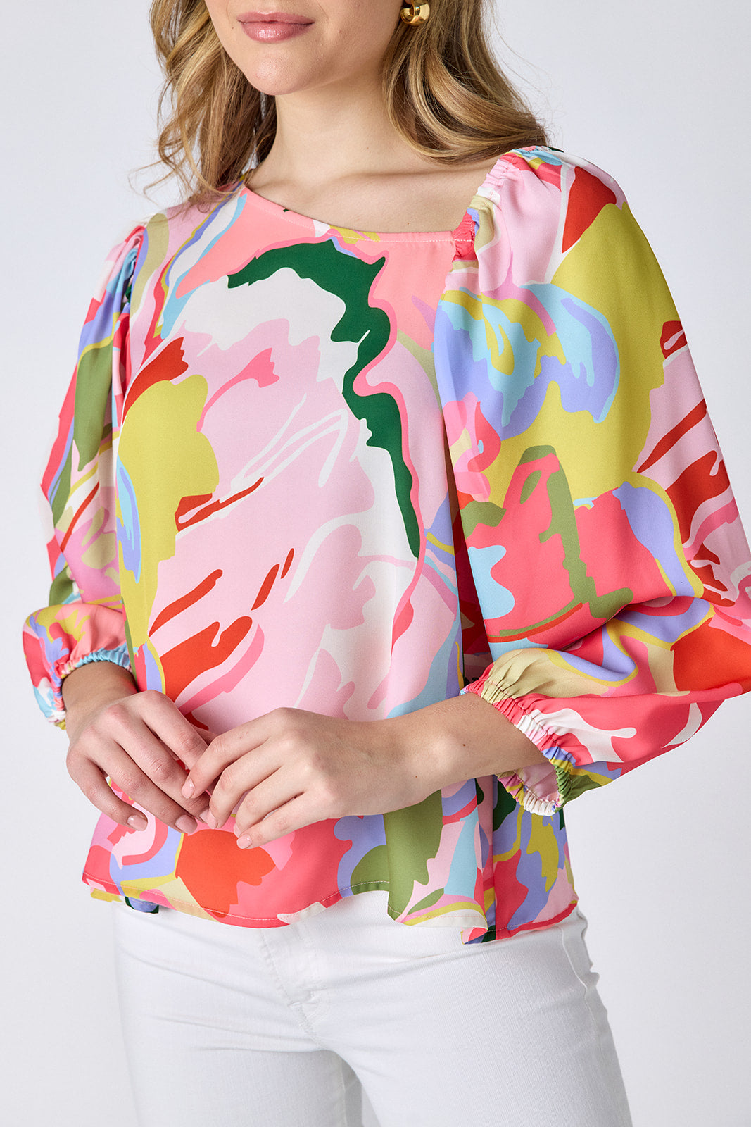 Flutter 3/4 sleeve top with asymmetrical neckline on model — CROSBY by Mollie Burch