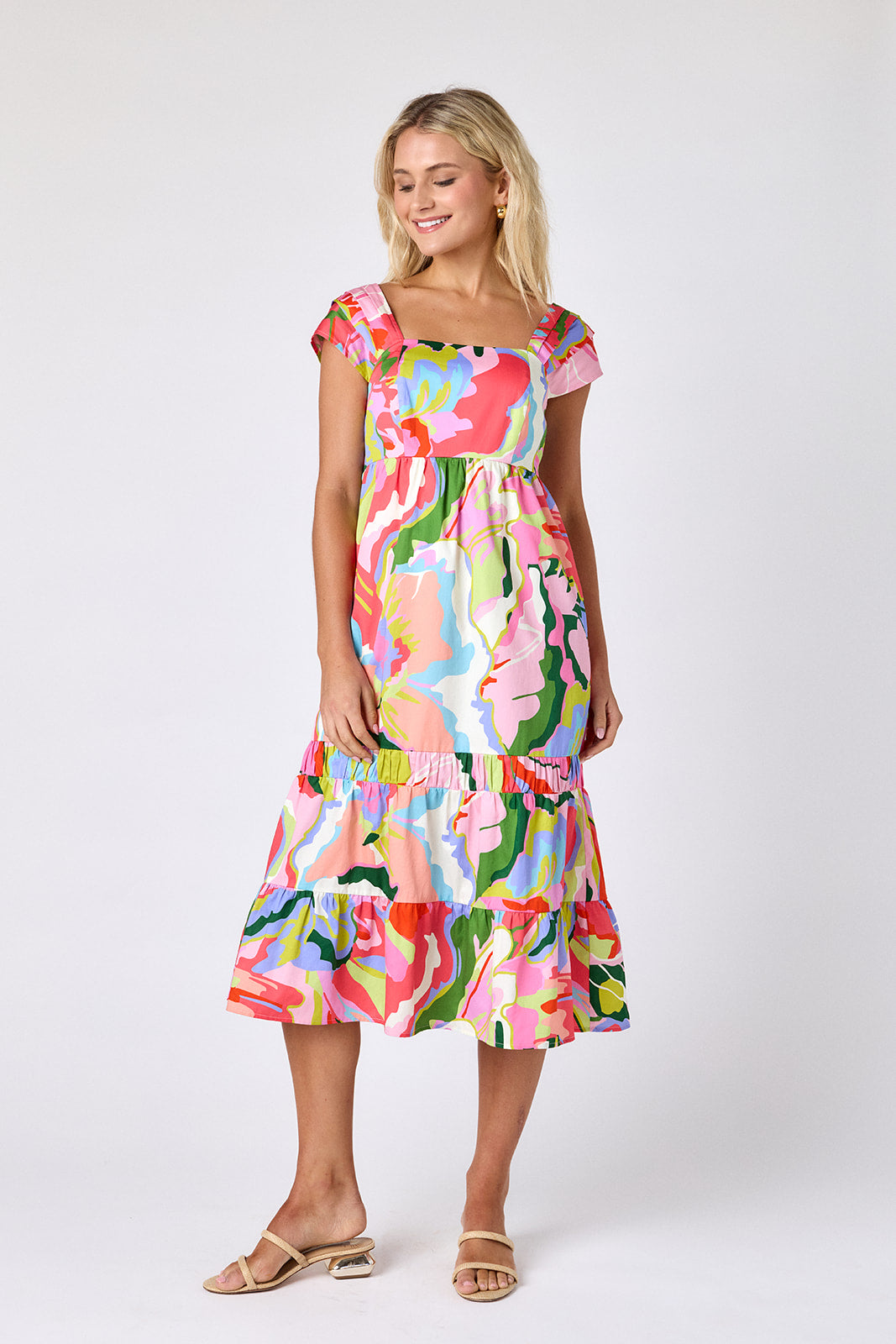 Flutter midi dress with square neckline and tiered skirt on model — CROSBY by Mollie Burch