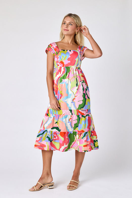 Flutter midi dress with square neckline and tiered skirt on model — CROSBY by Mollie Burch