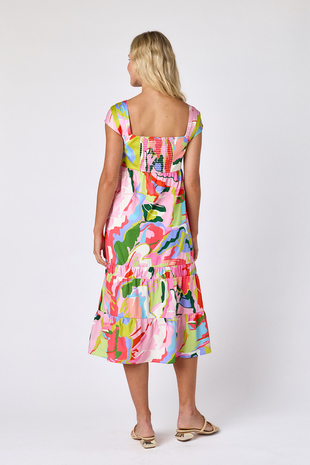 Flutter midi dress with square neckline and tiered skirt on model — CROSBY by Mollie Burch