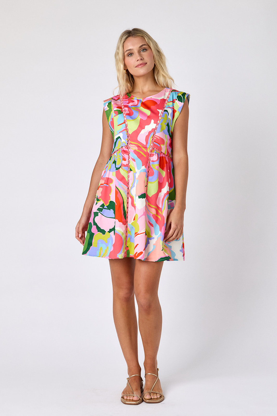 Flutter mini dress with fagoting detail on model — CROSBY by Mollie Burch