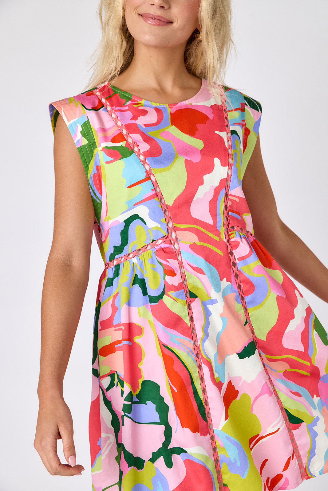 Flutter mini dress with fagoting detail on model — CROSBY by Mollie Burch