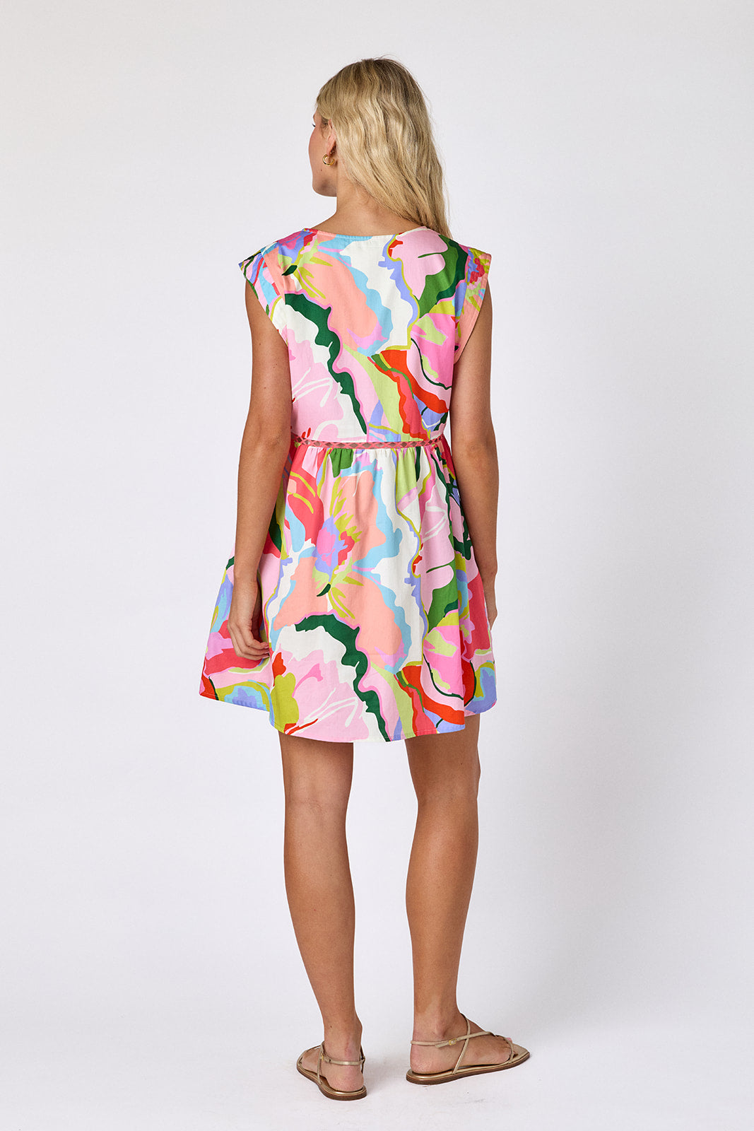 Flutter mini dress with fagoting detail on model — CROSBY by Mollie Burch