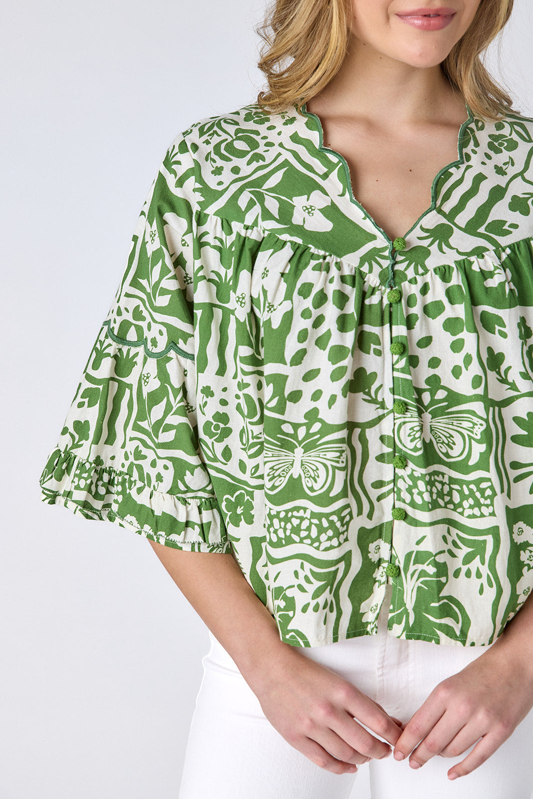 Gardener cotton top with scallop neckline and button-down front on model — CROSBY by Mollie Burch