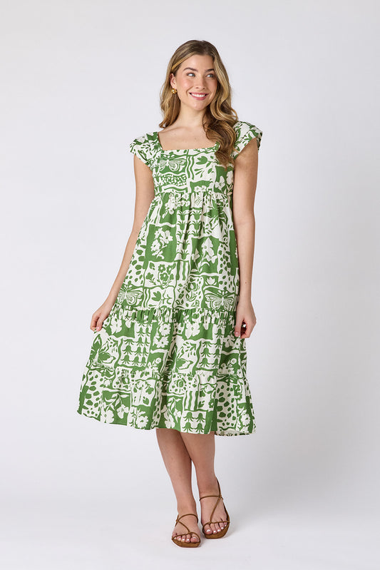 Gardener midi dress with square neckline and tiered skirt on model — CROSBY by Mollie Burch