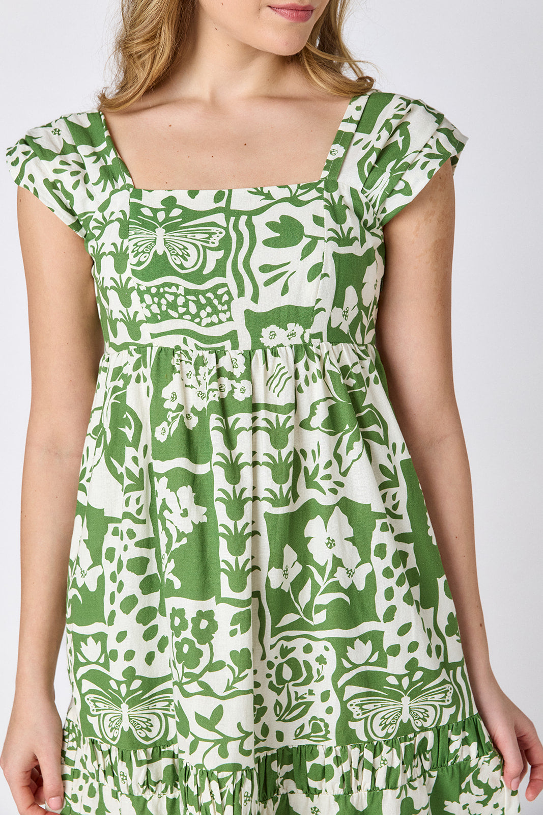Gardener midi dress with square neckline and tiered skirt on model — CROSBY by Mollie Burch
