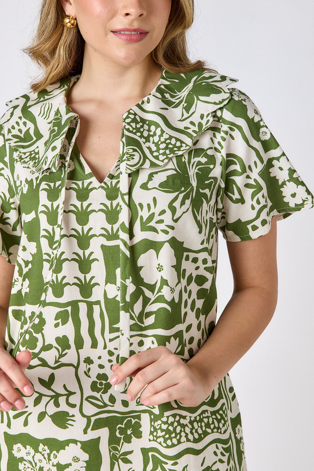 Gardener mini dress with scalloped collar and hem on model — CROSBY by Mollie Burch
