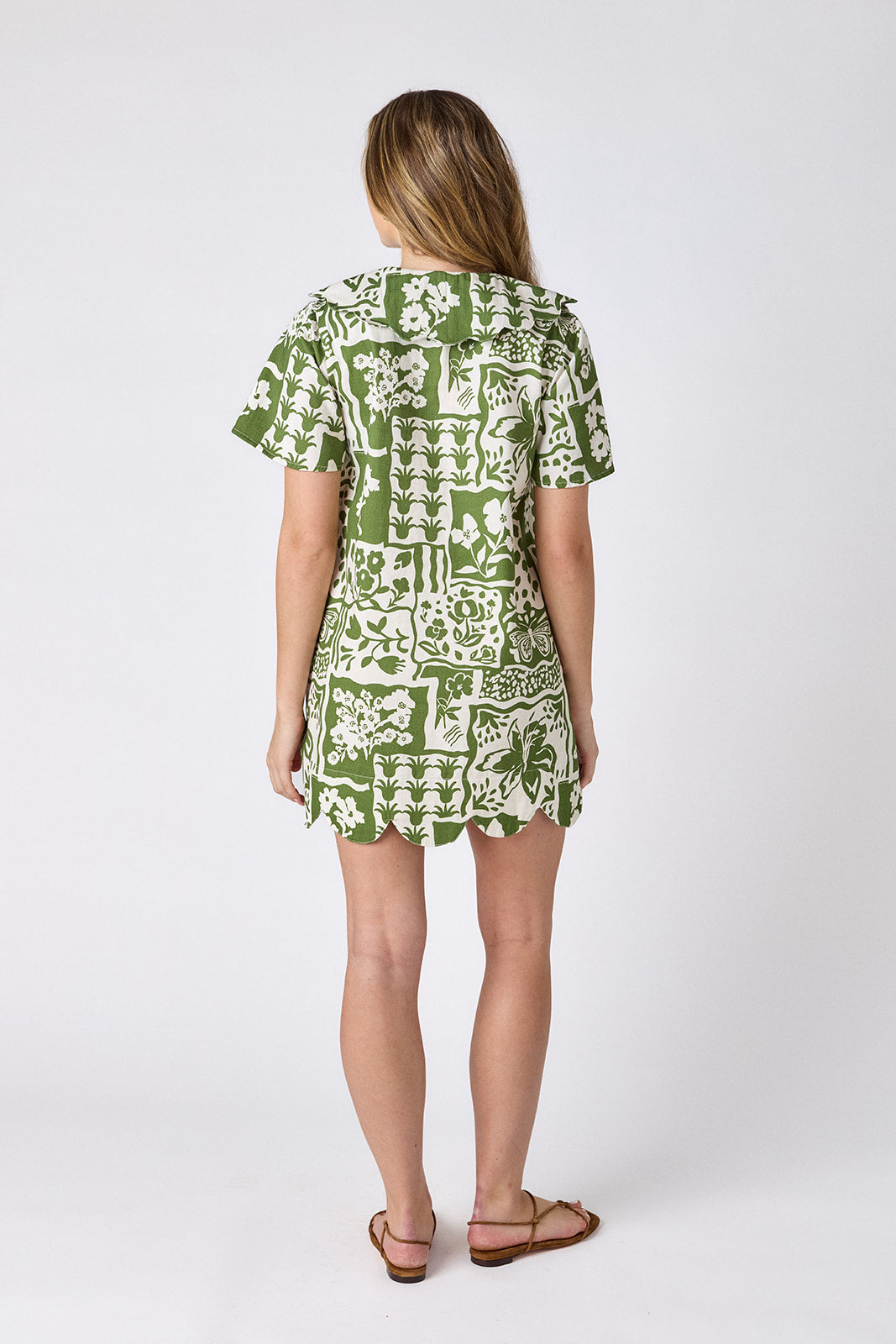 Gardener mini dress with scalloped collar and hem on model — CROSBY by Mollie Burch