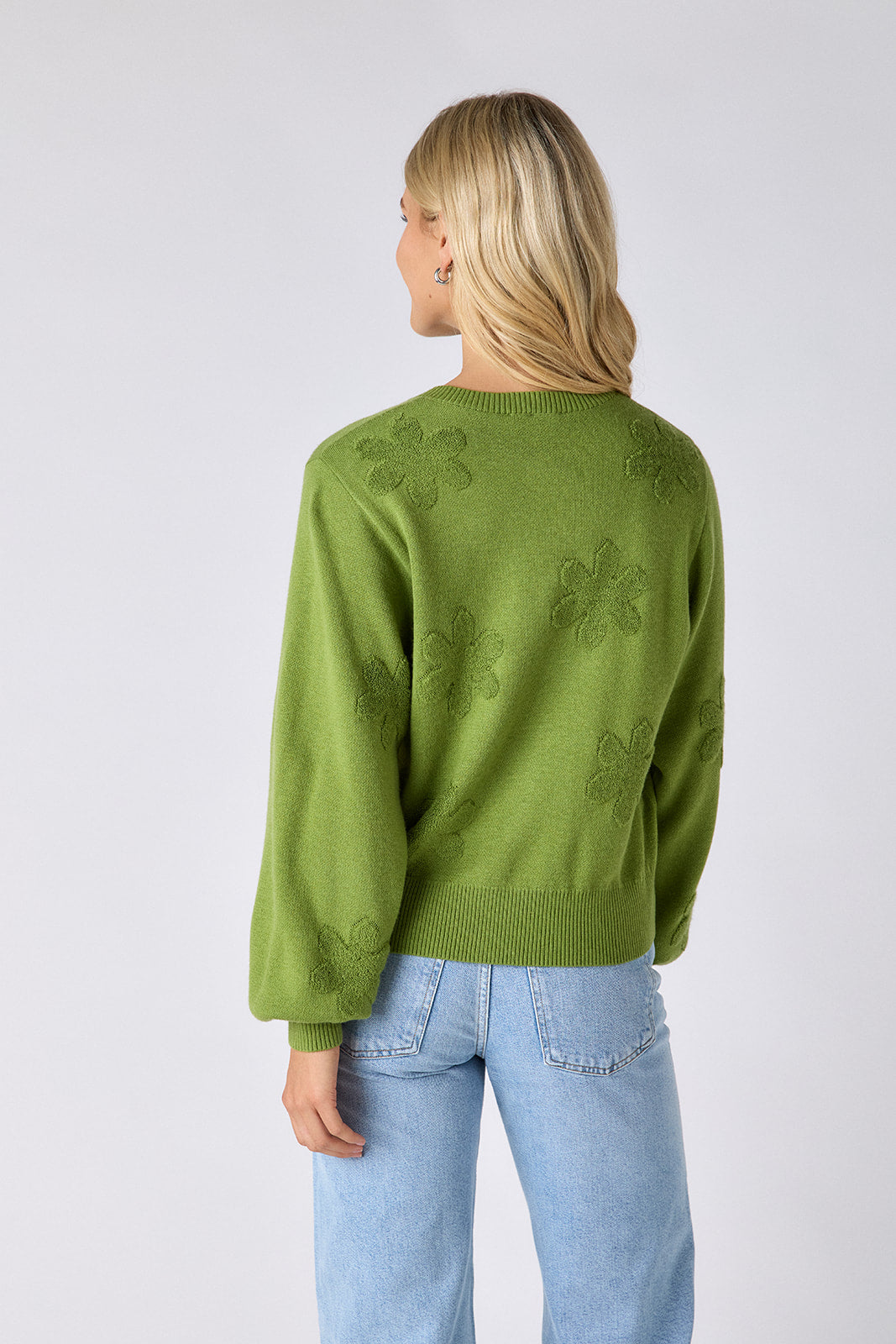 Grass sweater with floral intarsia detail and scalloped placket on model — CROSBY by Mollie Burch