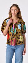 Happy Leopard button front top with balloon sleeves on model — CROSBY by Mollie Burch
