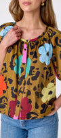 Happy Leopard button front top with balloon sleeves on model — CROSBY by Mollie Burch