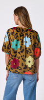 Happy Leopard button front top with balloon sleeves on model — CROSBY by Mollie Burch
