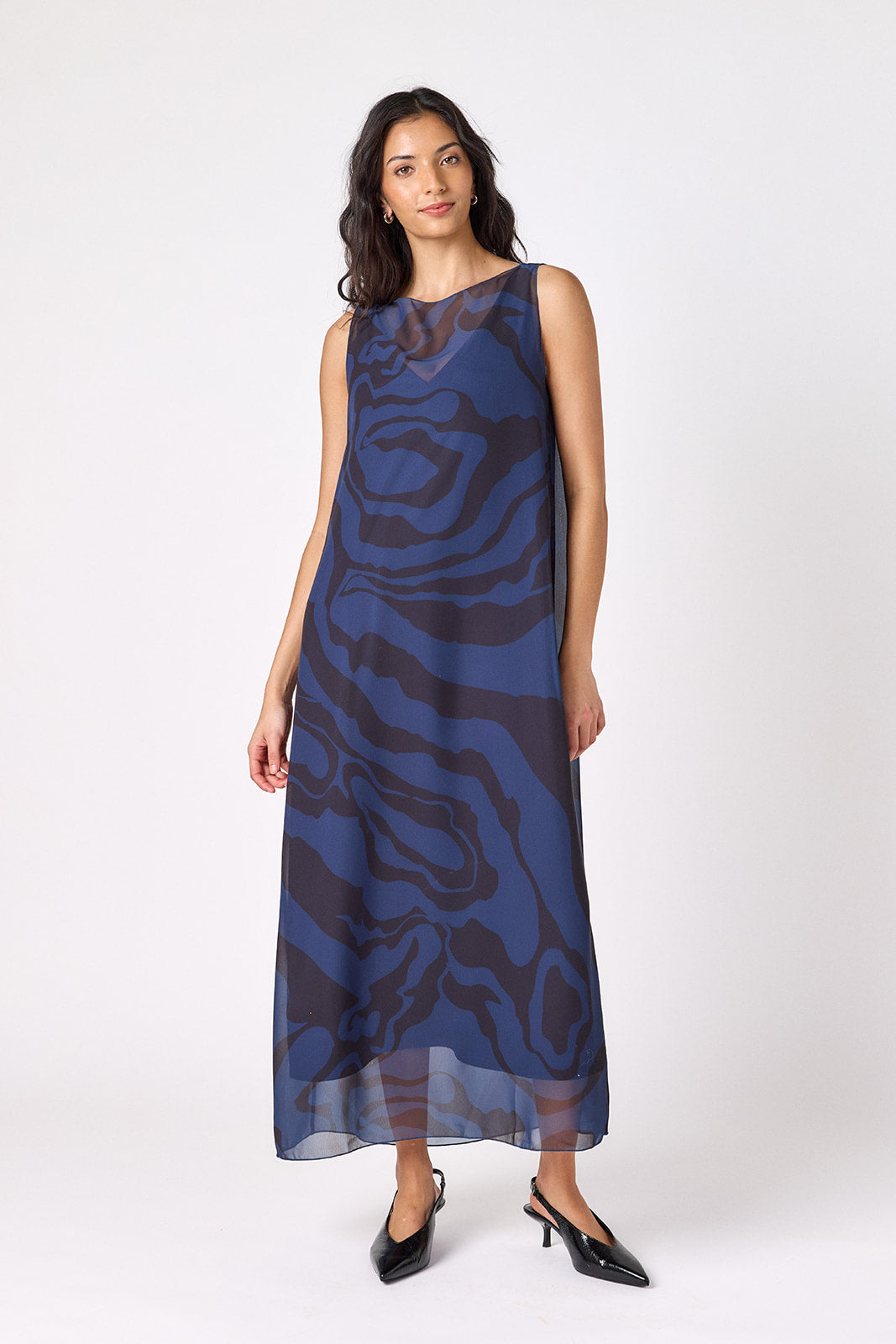 Ink Wave tent-style sleeveless dress with sheer overlay on model – CROSBY by Mollie Burch