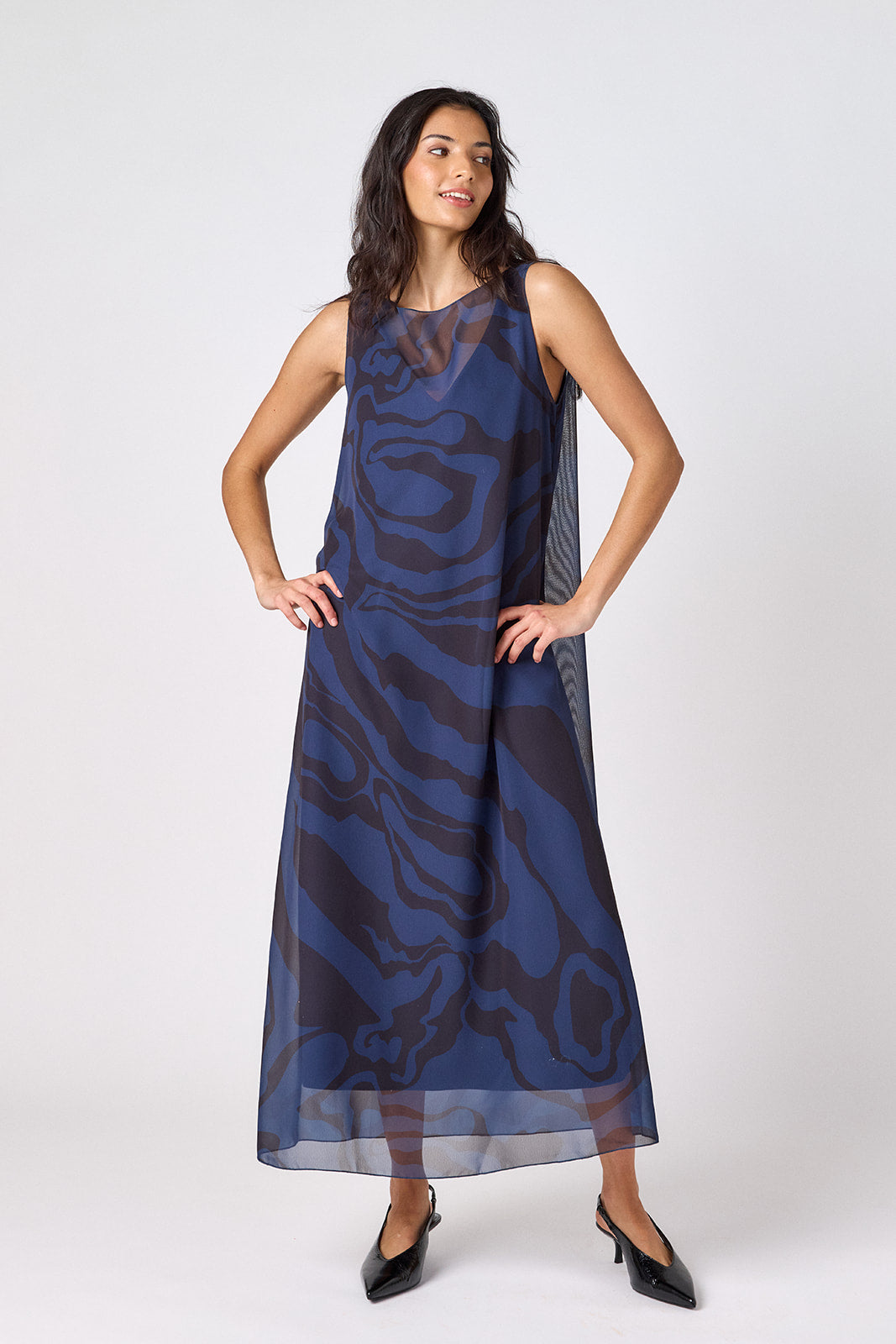 Ink Wave tent-style sleeveless dress with sheer overlay on model – CROSBY by Mollie Burch