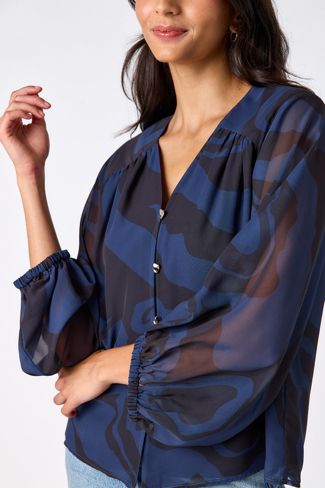 Ink Wave button-front v-neck blouse with voluminous sleeve on model – CROSBY by Mollie Burch