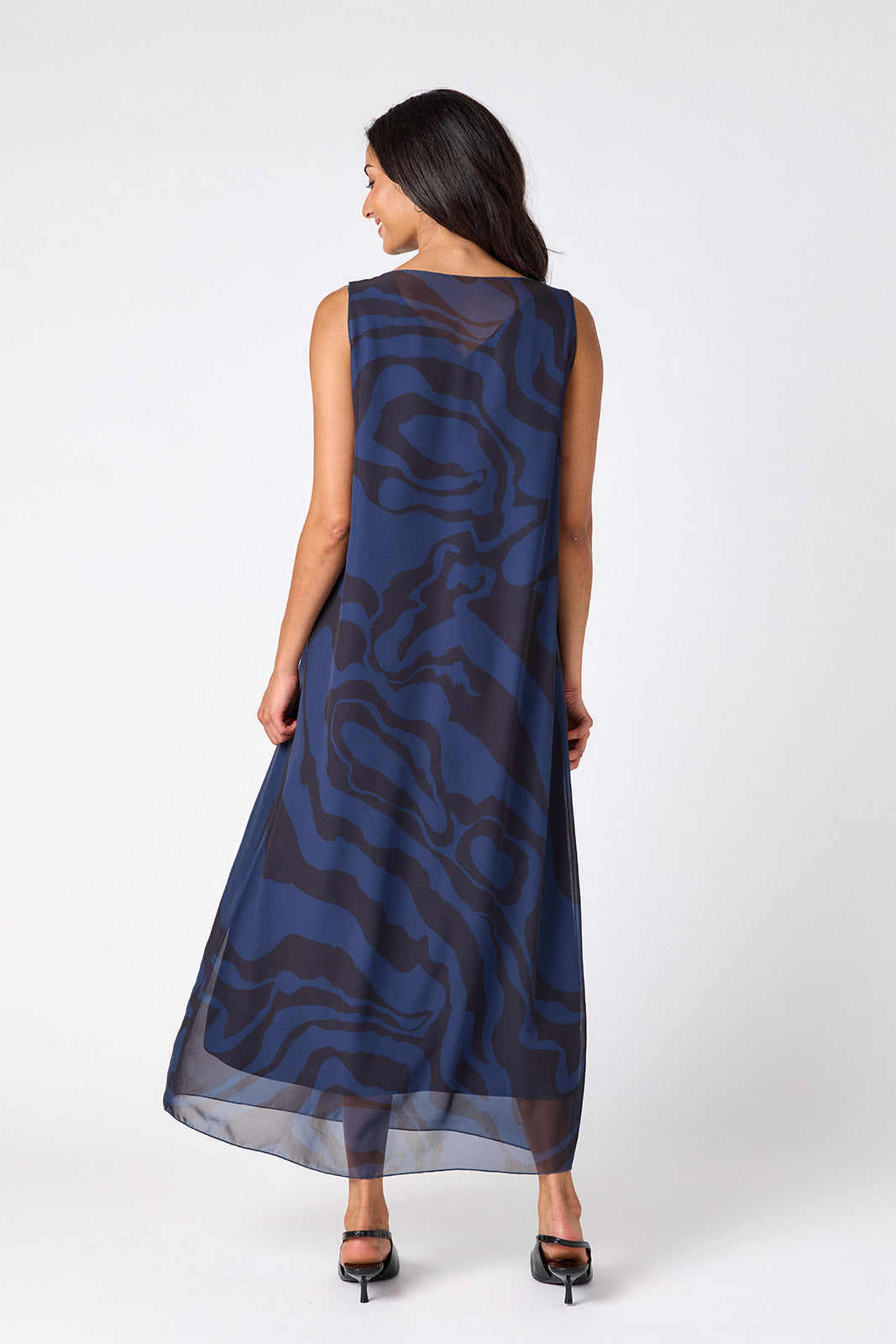 Ink Wave tent-style sleeveless dress with sheer overlay on model – CROSBY by Mollie Burch