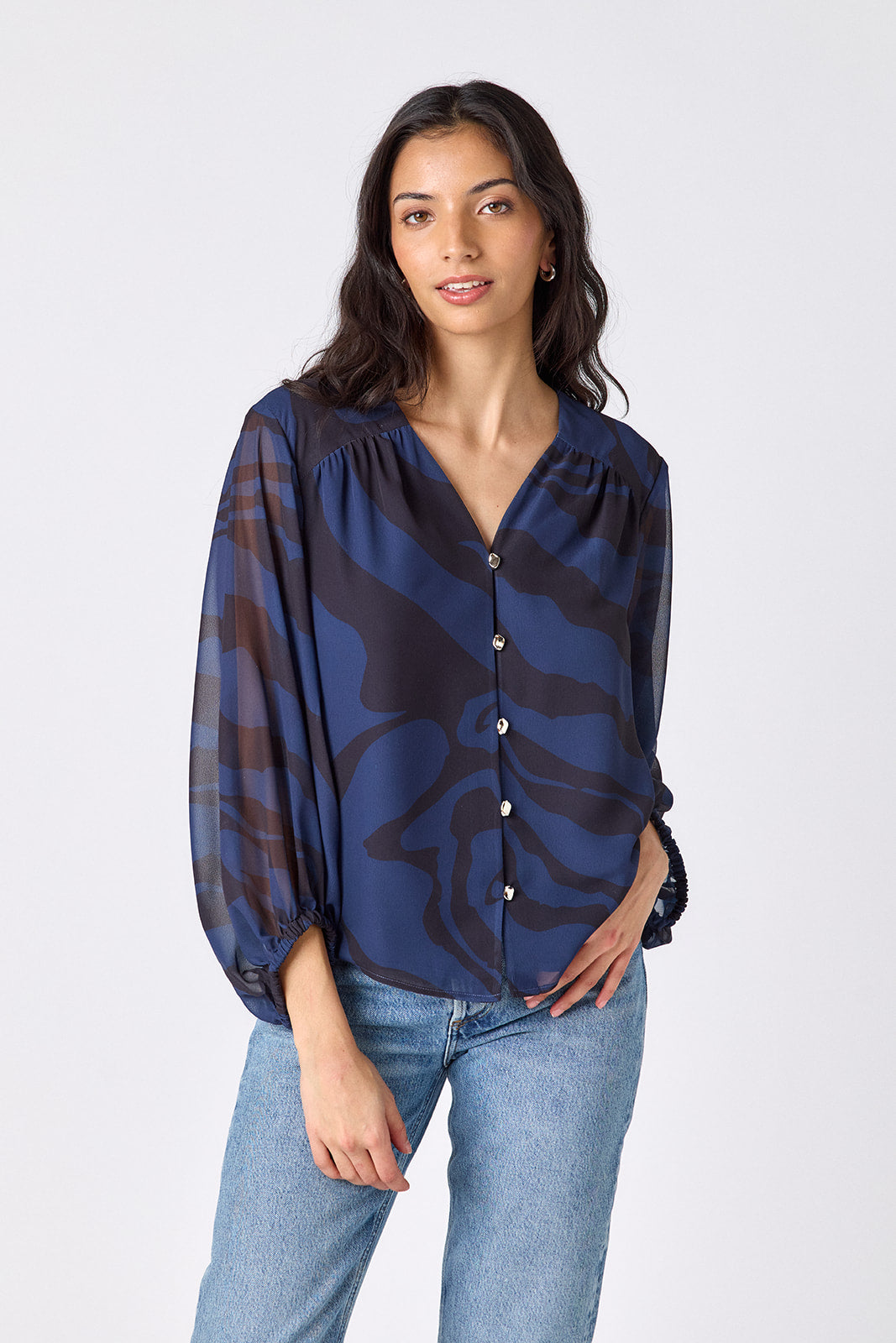 Ink Wave button-front v-neck blouse with voluminous sleeve on model – CROSBY by Mollie Burch