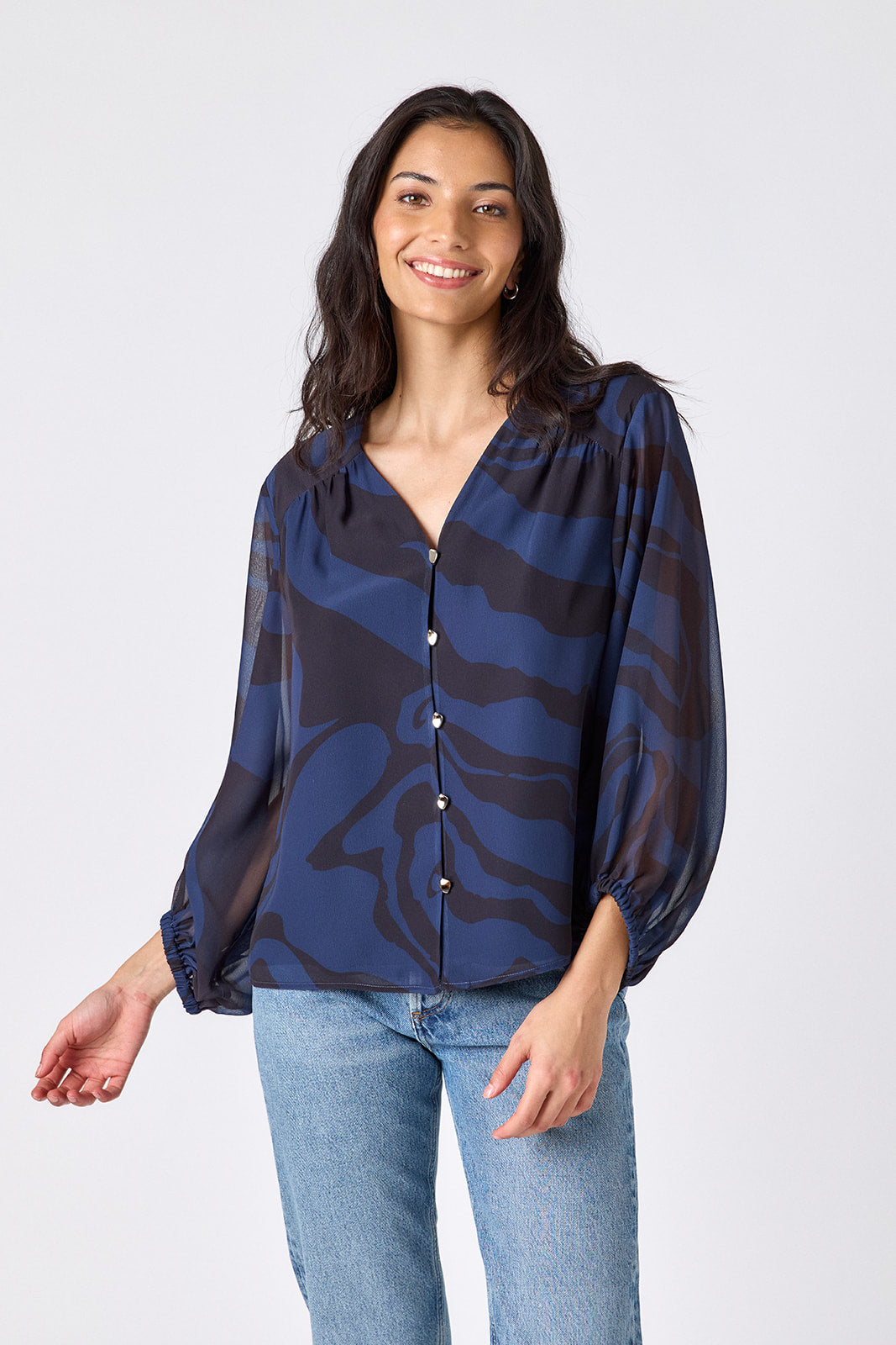Ink Wave button-front v-neck blouse with voluminous sleeve on model – CROSBY by Mollie Burch