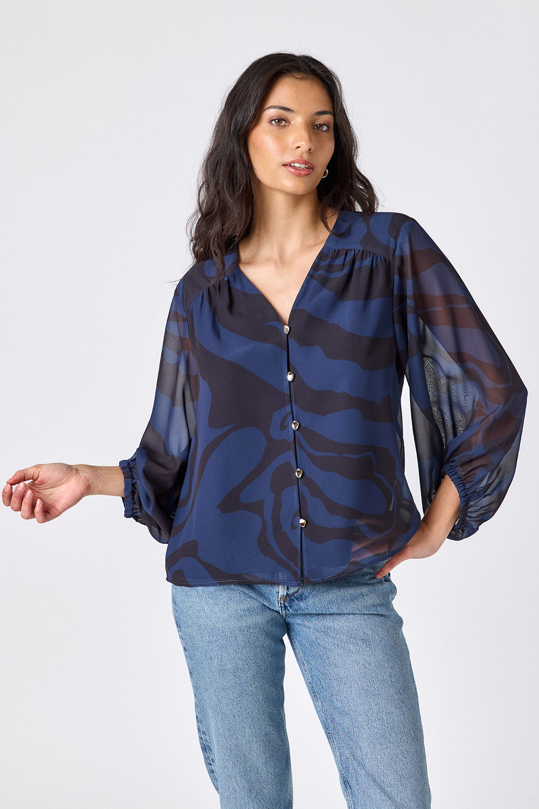 Ink Wave button-front v-neck blouse with voluminous sleeve on model – CROSBY by Mollie Burch