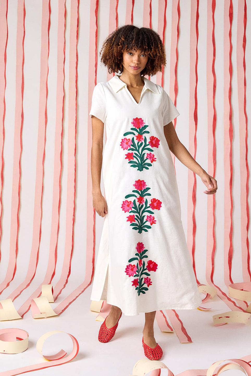 Ivory short sleeve A-line split collared dress with embroidery detail on model — CROSBY by Mollie Burch