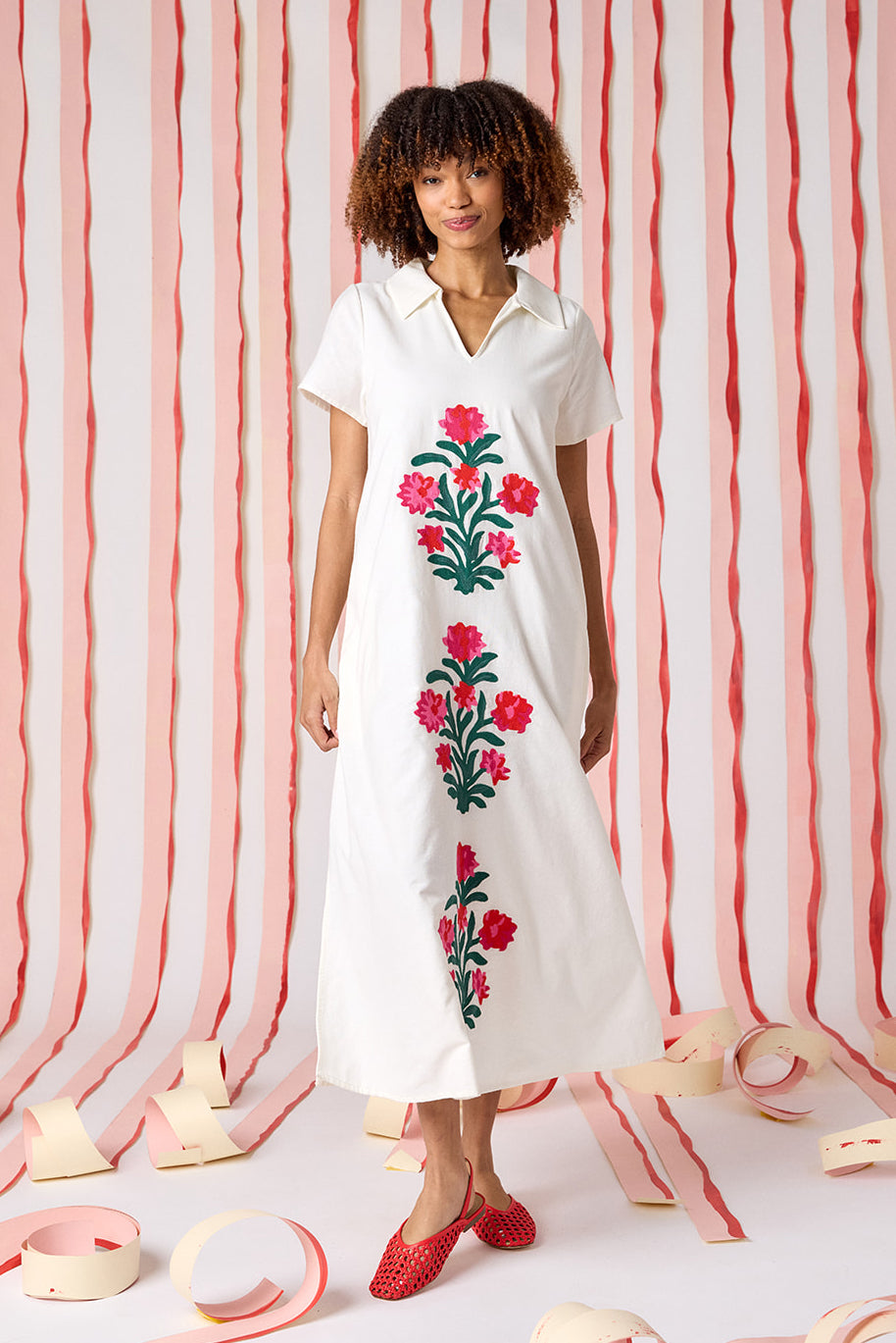 Ivory short sleeve A-line split collared dress with embroidery detail on model — CROSBY by Mollie Burch