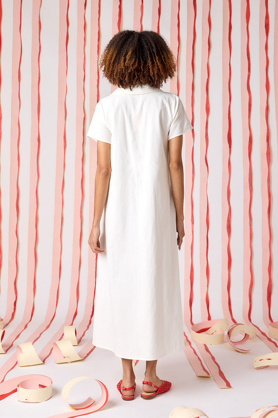 Ivory short sleeve A-line split collared dress with embroidery detail on model — CROSBY by Mollie Burch
