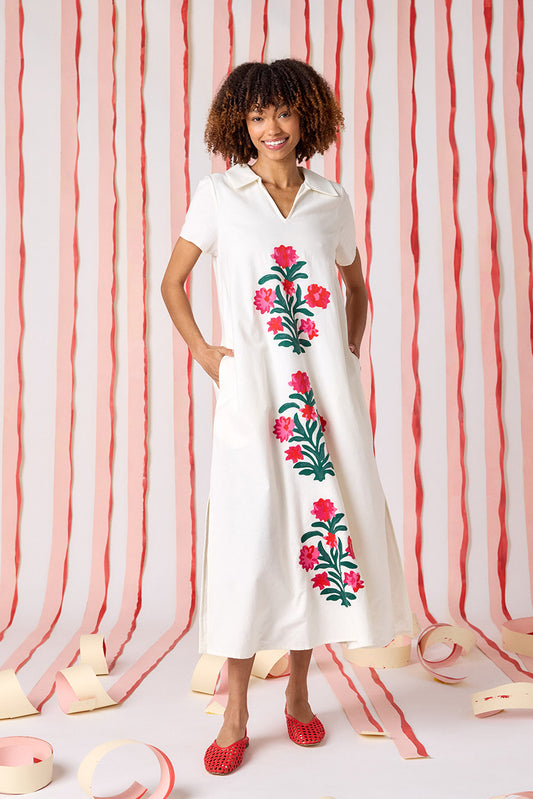 Ivory short sleeve A-line split collared dress with embroidery detail on model — CROSBY by Mollie Burch