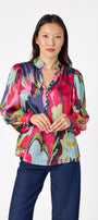 Leland Blouse in Life of the Party featuring puff sleeves and milky pink, gold-rimmed buttons on model – CROSBY by Mollie Burch