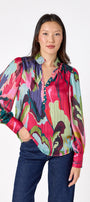 Leland Blouse in Life of the Party featuring puff sleeves and milky pink, gold-rimmed buttons on model – CROSBY by Mollie Burch