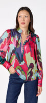 Leland Blouse in Life of the Party featuring puff sleeves and milky pink, gold-rimmed buttons on model – CROSBY by Mollie Burch