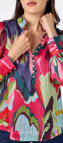 Leland Blouse in Life of the Party featuring puff sleeves and milky pink, gold-rimmed buttons on model – CROSBY by Mollie Burch