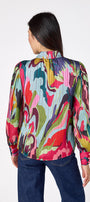 Leland Blouse in Life of the Party featuring puff sleeves and milky pink, gold-rimmed buttons on model – CROSBY by Mollie Burch