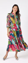 Macrostie Dress in Life of the Party featuring a tiered midi skirt and gold-accented buttons on model – CROSBY by Mollie Burch