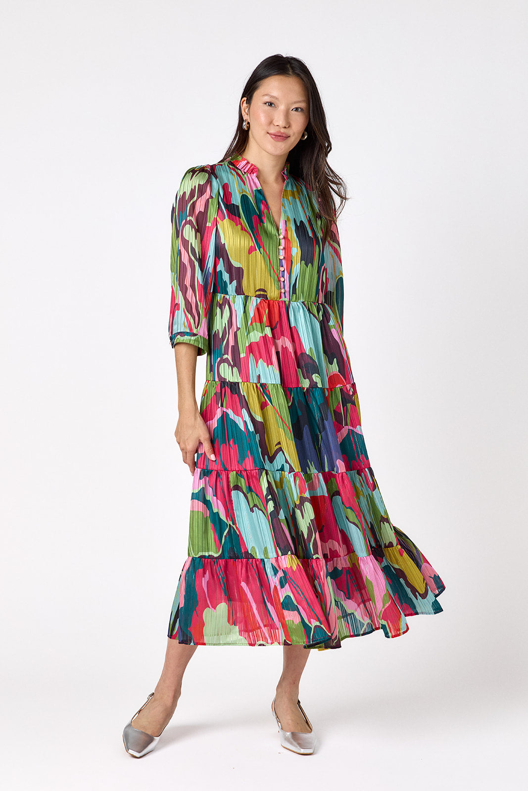 Macrostie Dress in Life of the Party featuring a tiered midi skirt and gold-accented buttons on model – CROSBY by Mollie Burch