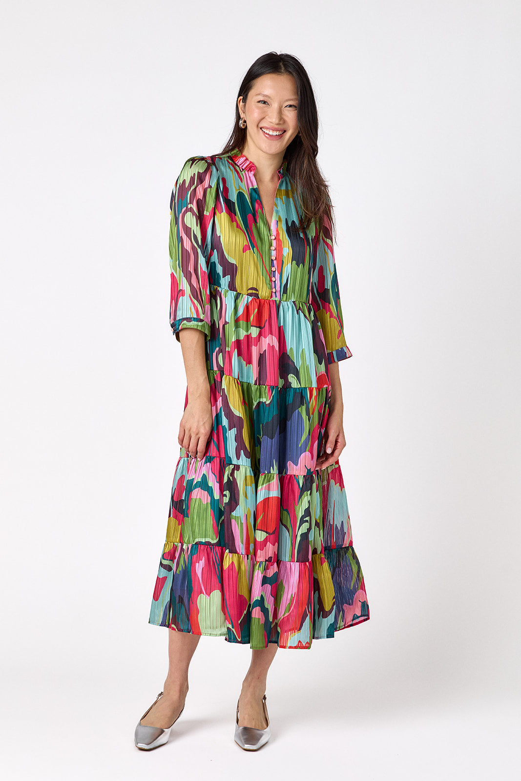 Macrostie Dress in Life of the Party featuring a tiered midi skirt and gold-accented buttons on model – CROSBY by Mollie Burch