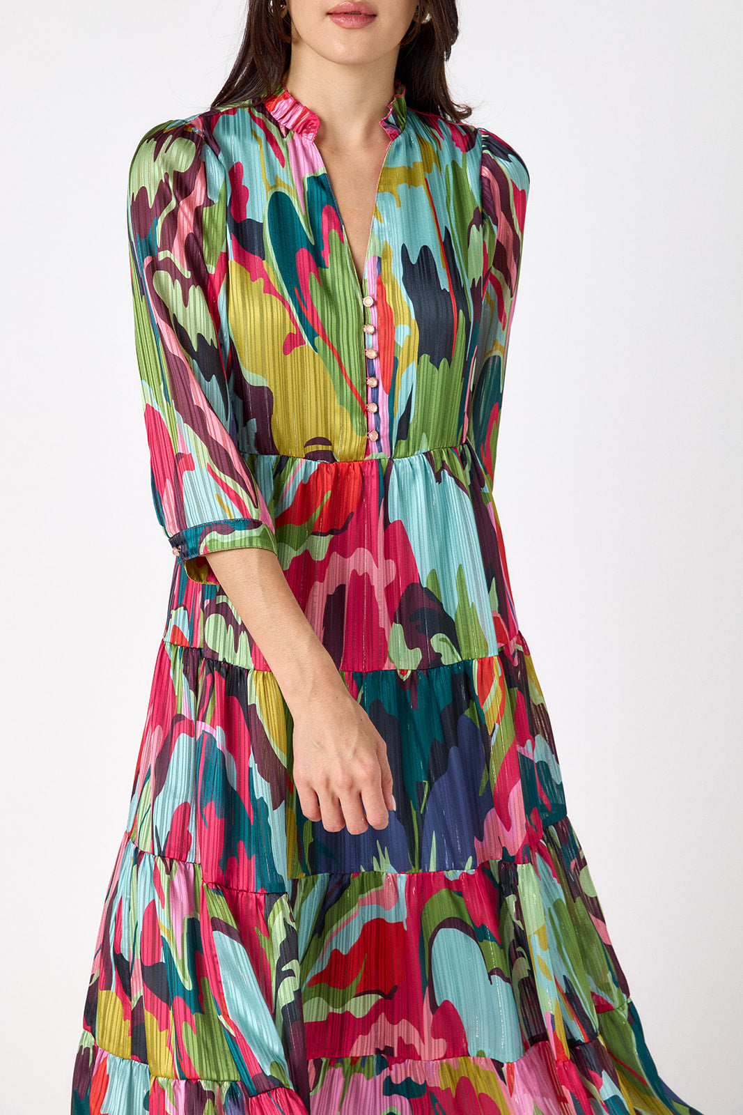 Macrostie Dress in Life of the Party featuring a tiered midi skirt and gold-accented buttons on model – CROSBY by Mollie Burch